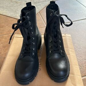 Steve Madden heeled lace up combat boots. New in box.